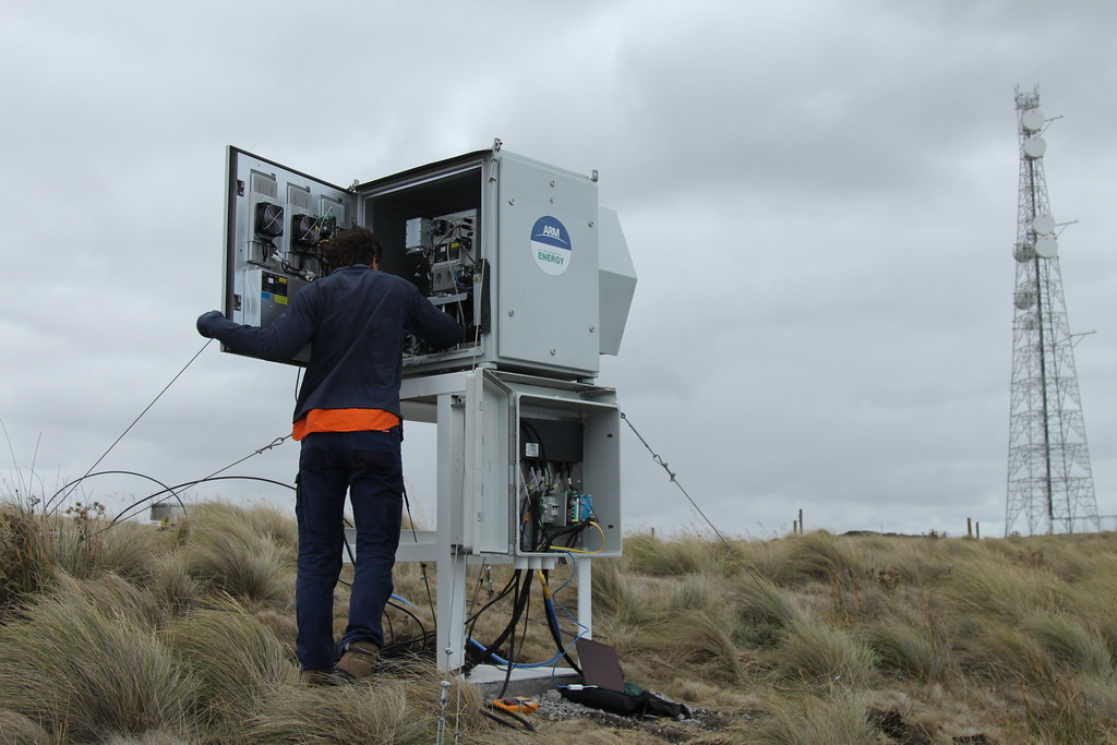 ARM instrument mentor Jon Gero installs a marine atmospheric emitted radiance interferometer at the CAPE-k site in February 2024. The instrument, which can be deployed at sea, measures infrared spectral radiance. Photo is courtesy of ARM. 