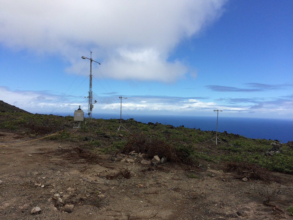 Surface meteorology systems are located on a rocky hillside overlooking the Atlantic Ocean.